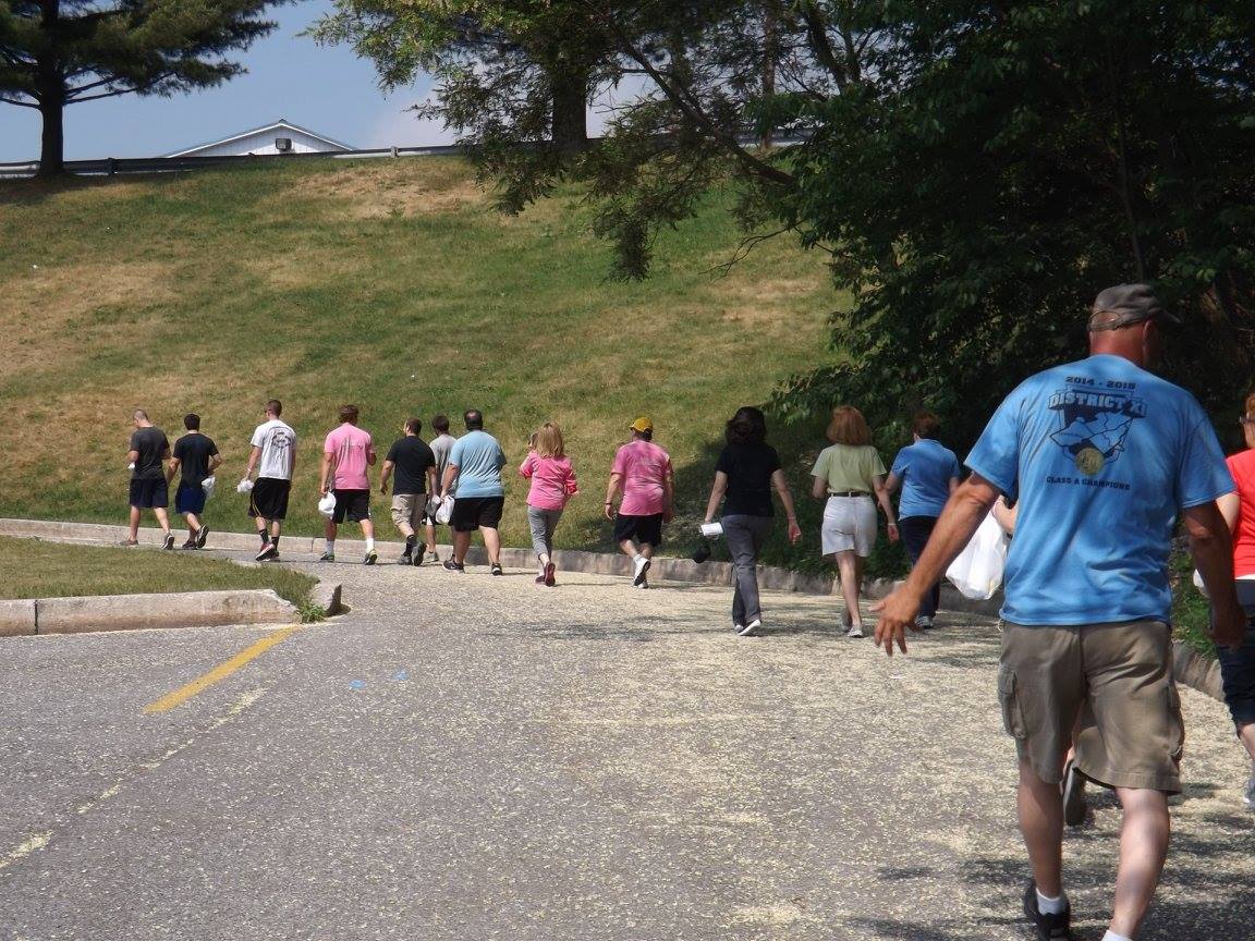 group of people walking in park