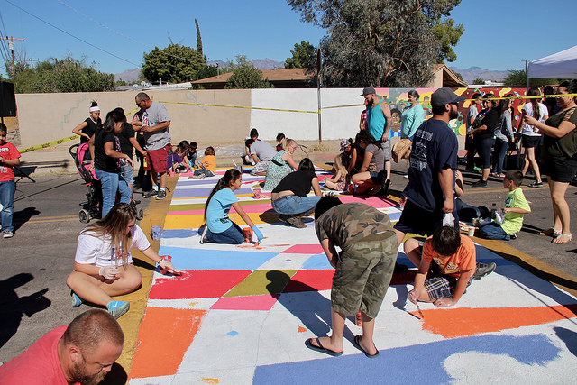 pueblo gardens working on street mural