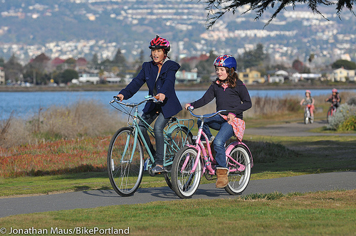 Two girls riding