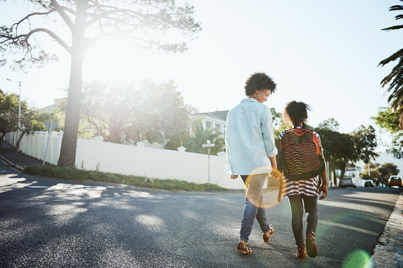 mom and daughter walking