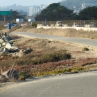 male riding bike along trail near coastline