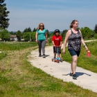 people walking on sidewalk in park